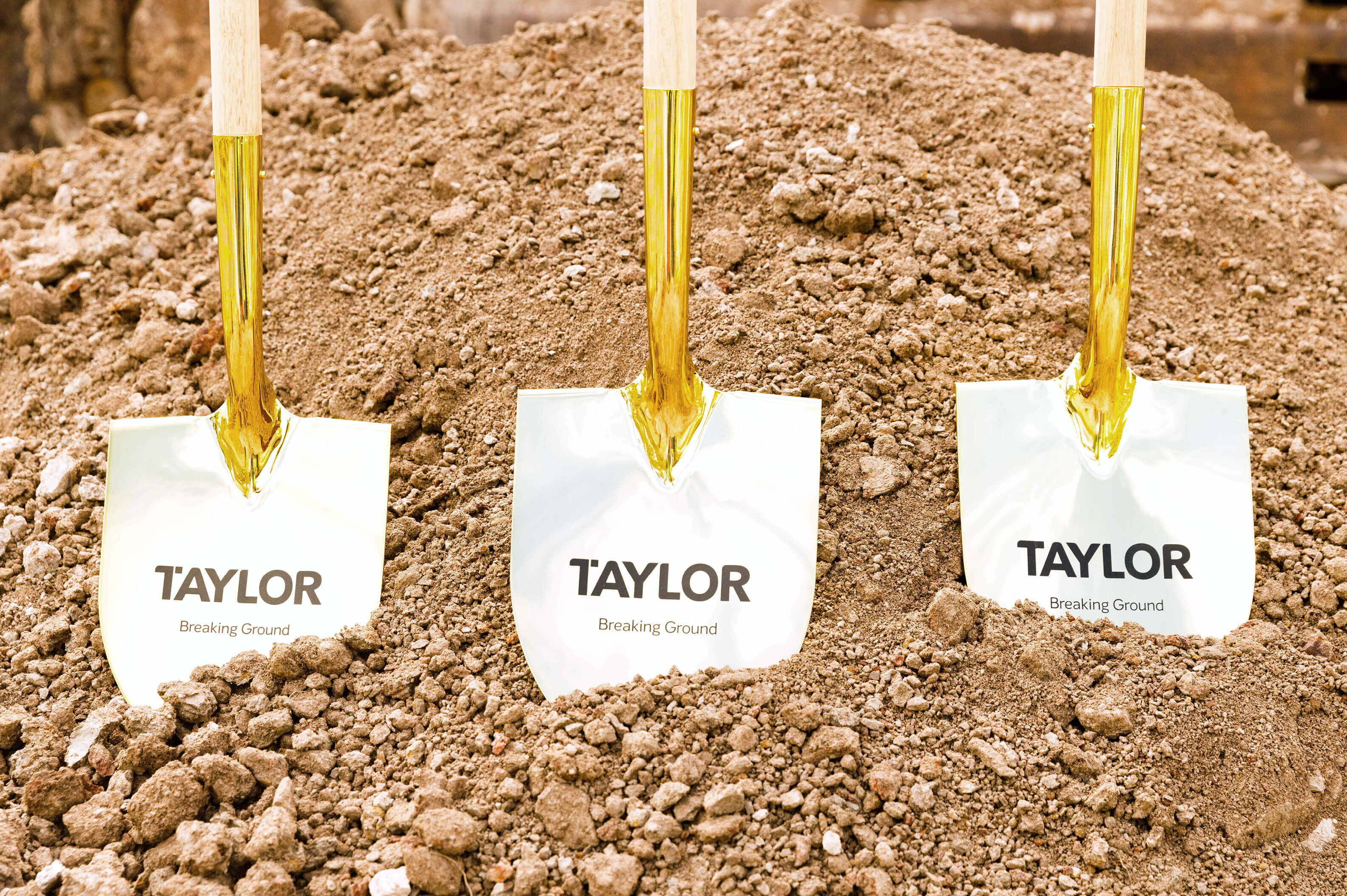 03 close up of taylor shovels in soil for breaking ground taylor news article breaking ground alongside nsw land