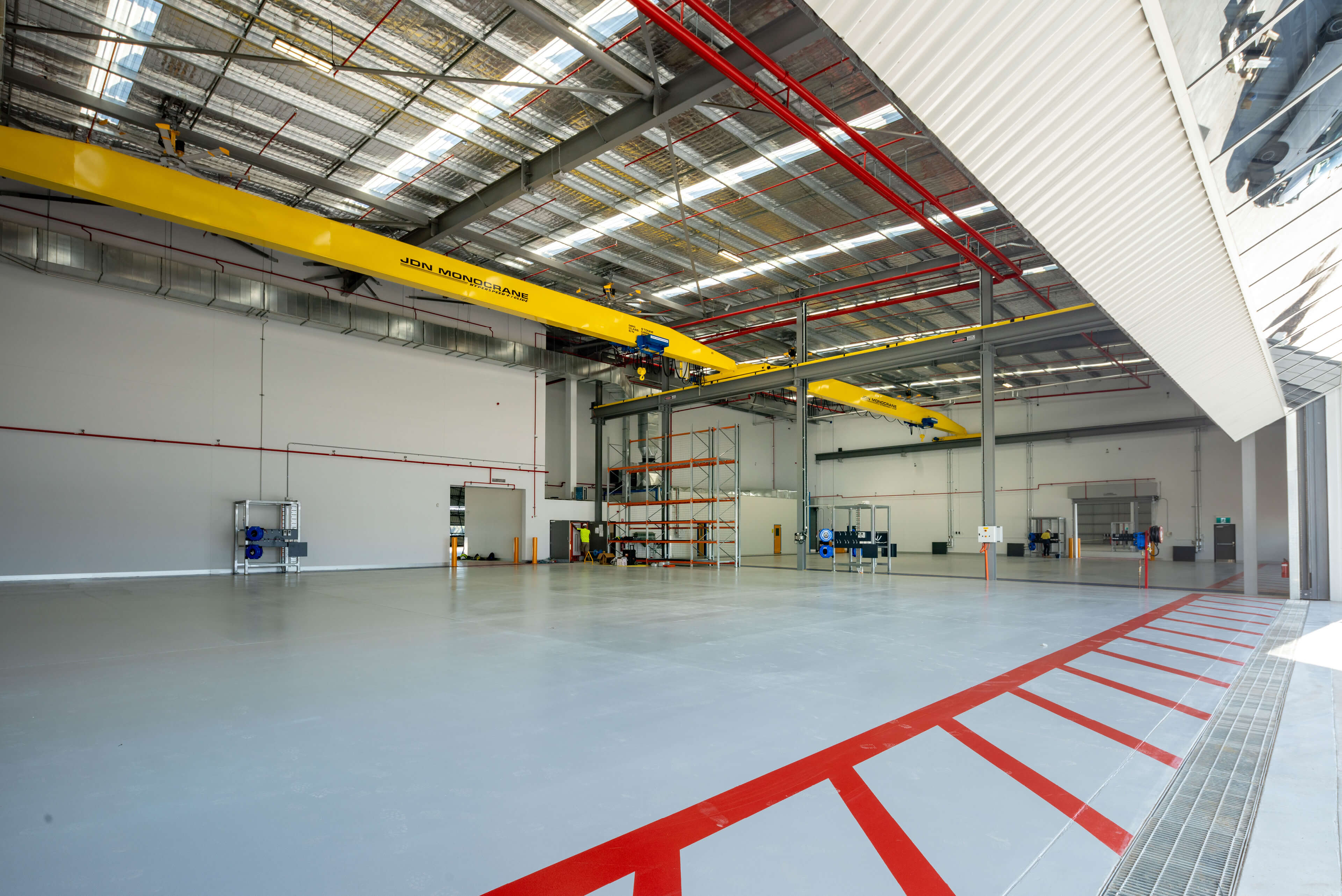 10 interior view of hangar bays with red floor markings for fixed wing operation at polair facility bankstown taylor construction refurbishment and live environments
