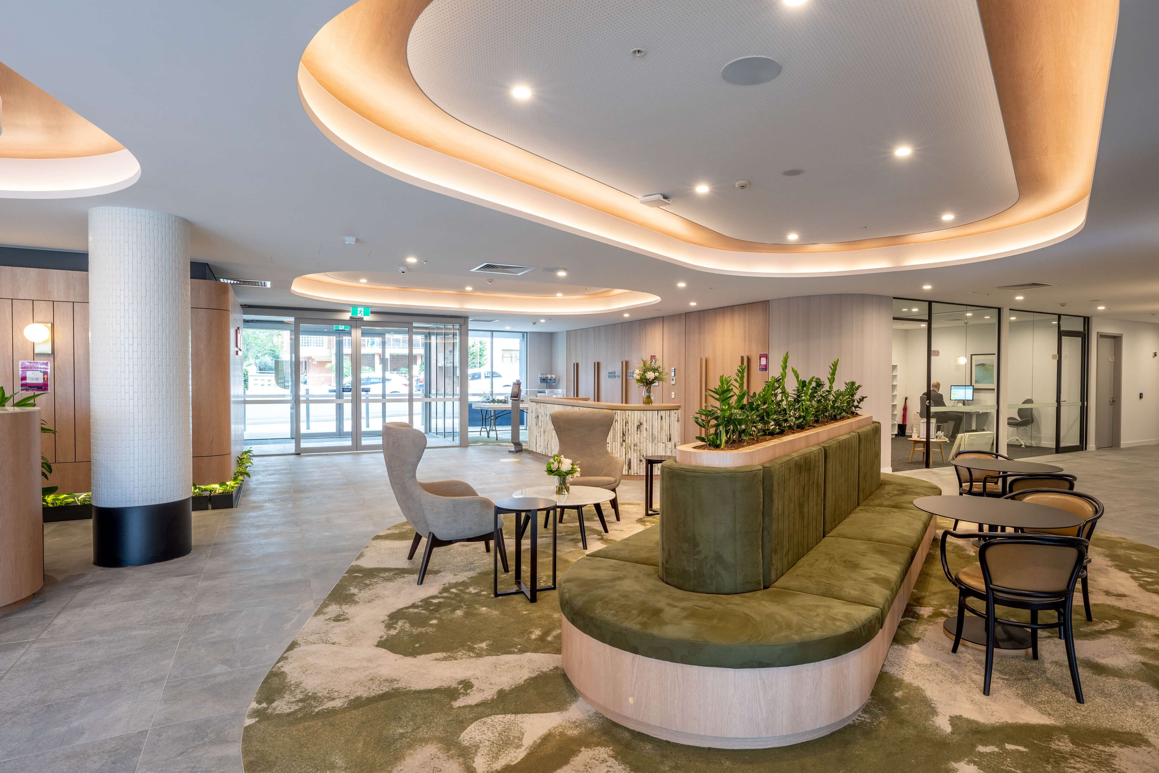 11 uniting main entry and reception with oval seating feature at uniting mayflower westmead taylor construction aged care