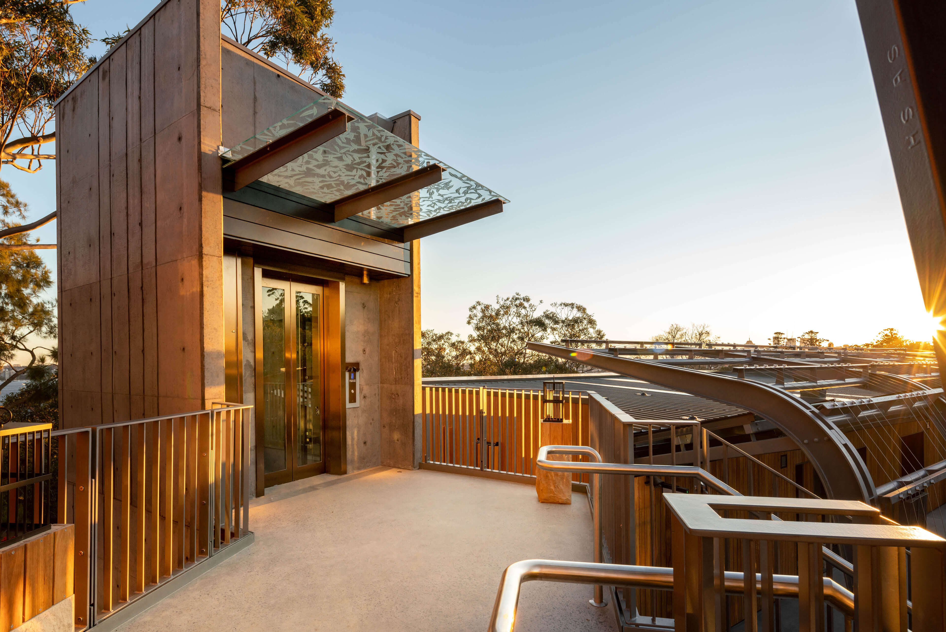 13 sun setting on lift feature and connecting pathways to accomodation at taronga wildlife retreat sydney taylor construction hospitality