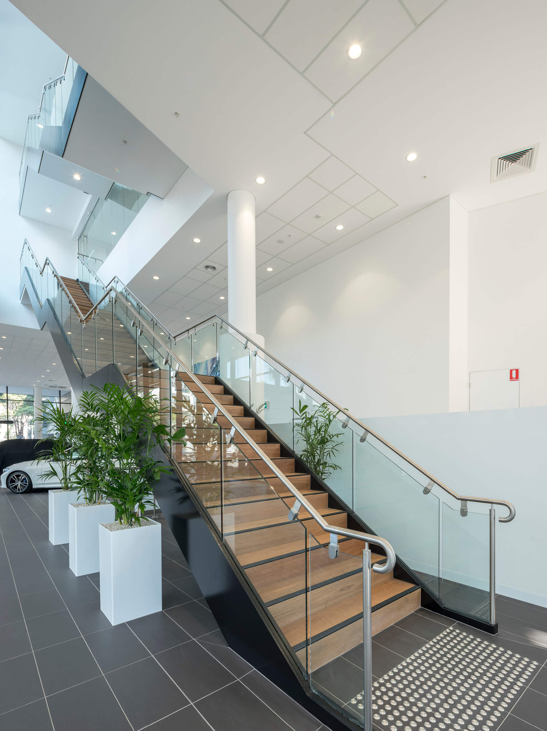 14 internal stair feature to office spaces at bmw and mini redevelopment sydney taylor construction motor showrooms