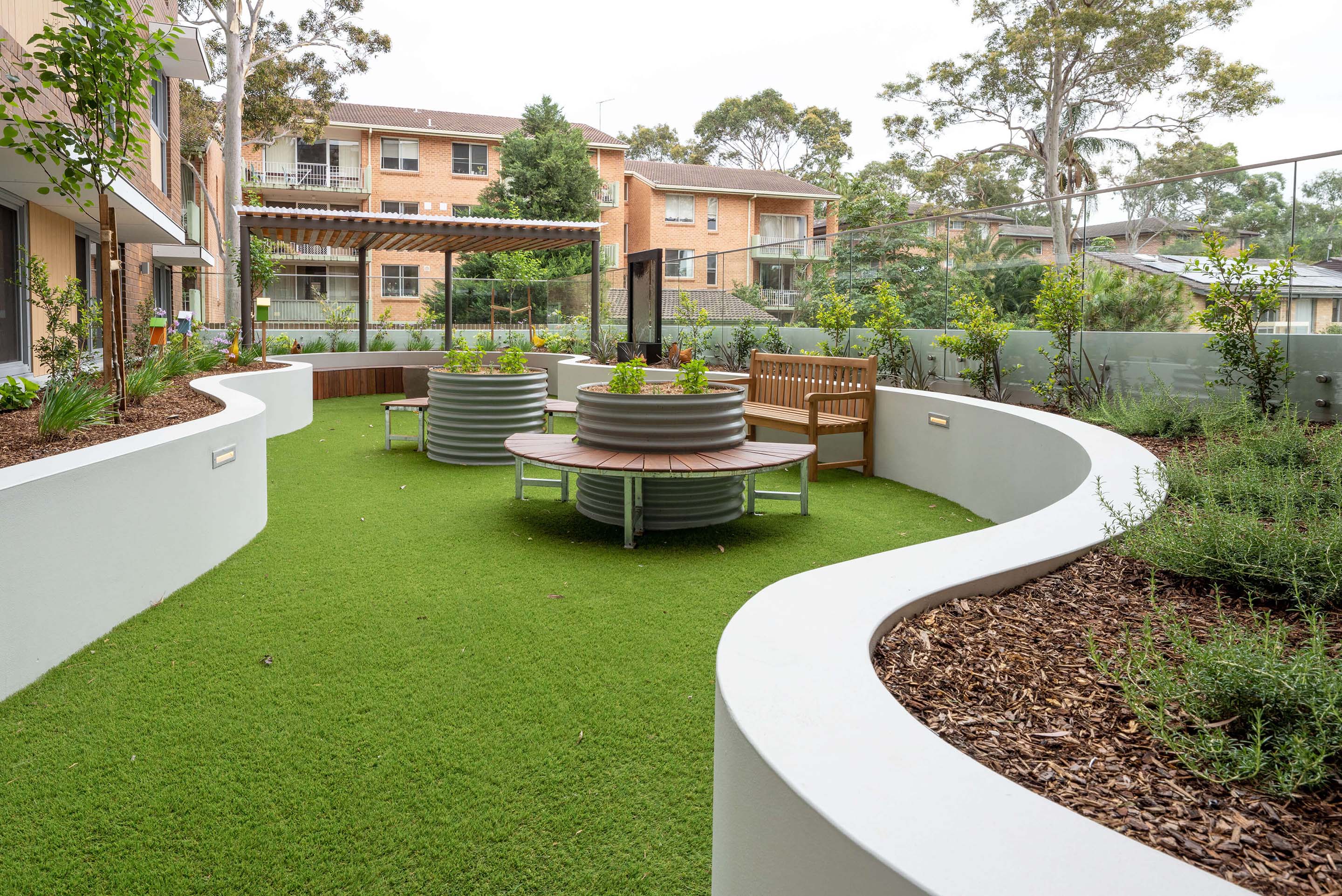19 external landscaped village community area at uniting mayflower westmead taylor construction aged care
