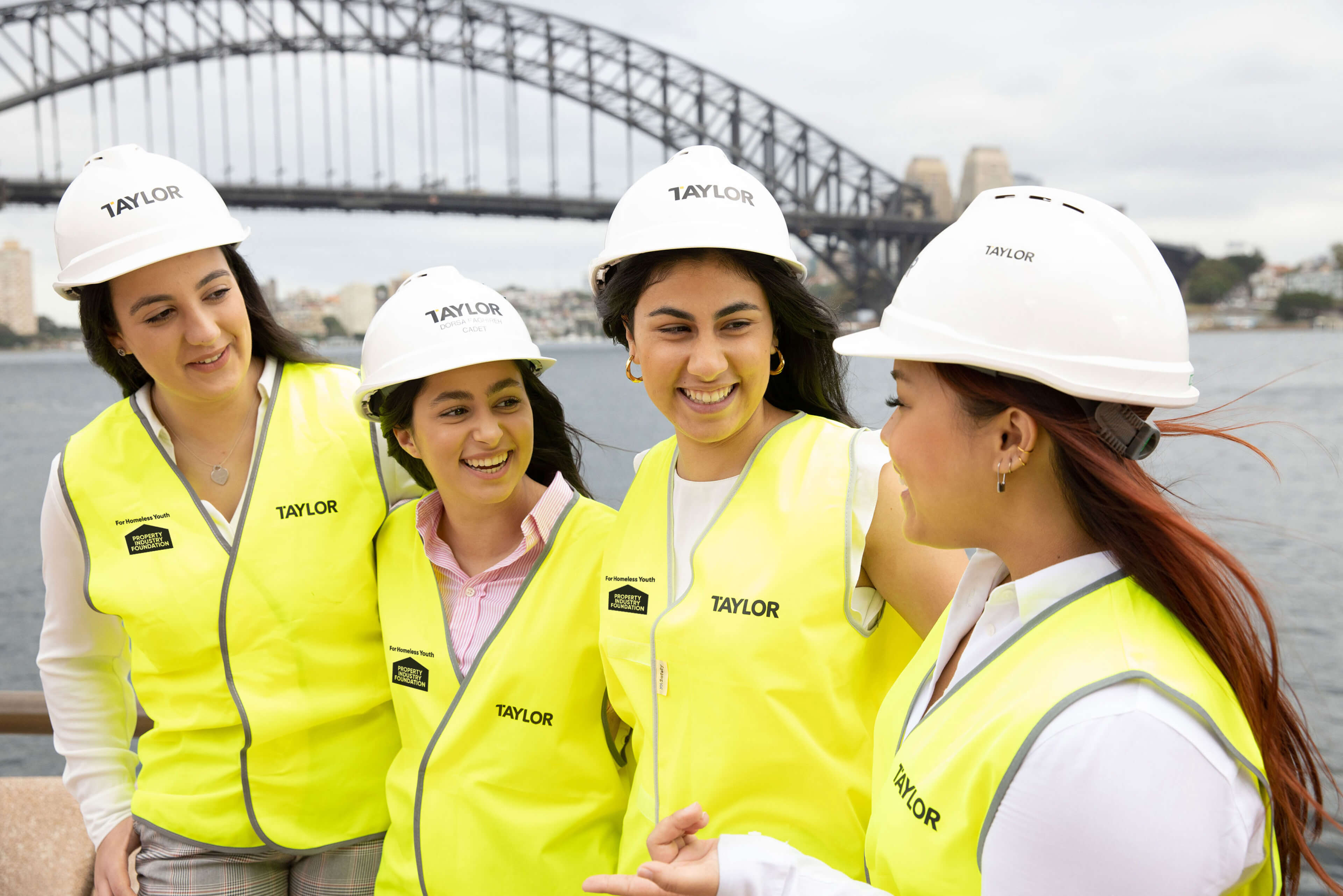 4 group of female cadet by sydney harbour bridge taylor construction photography twic women breaking ground