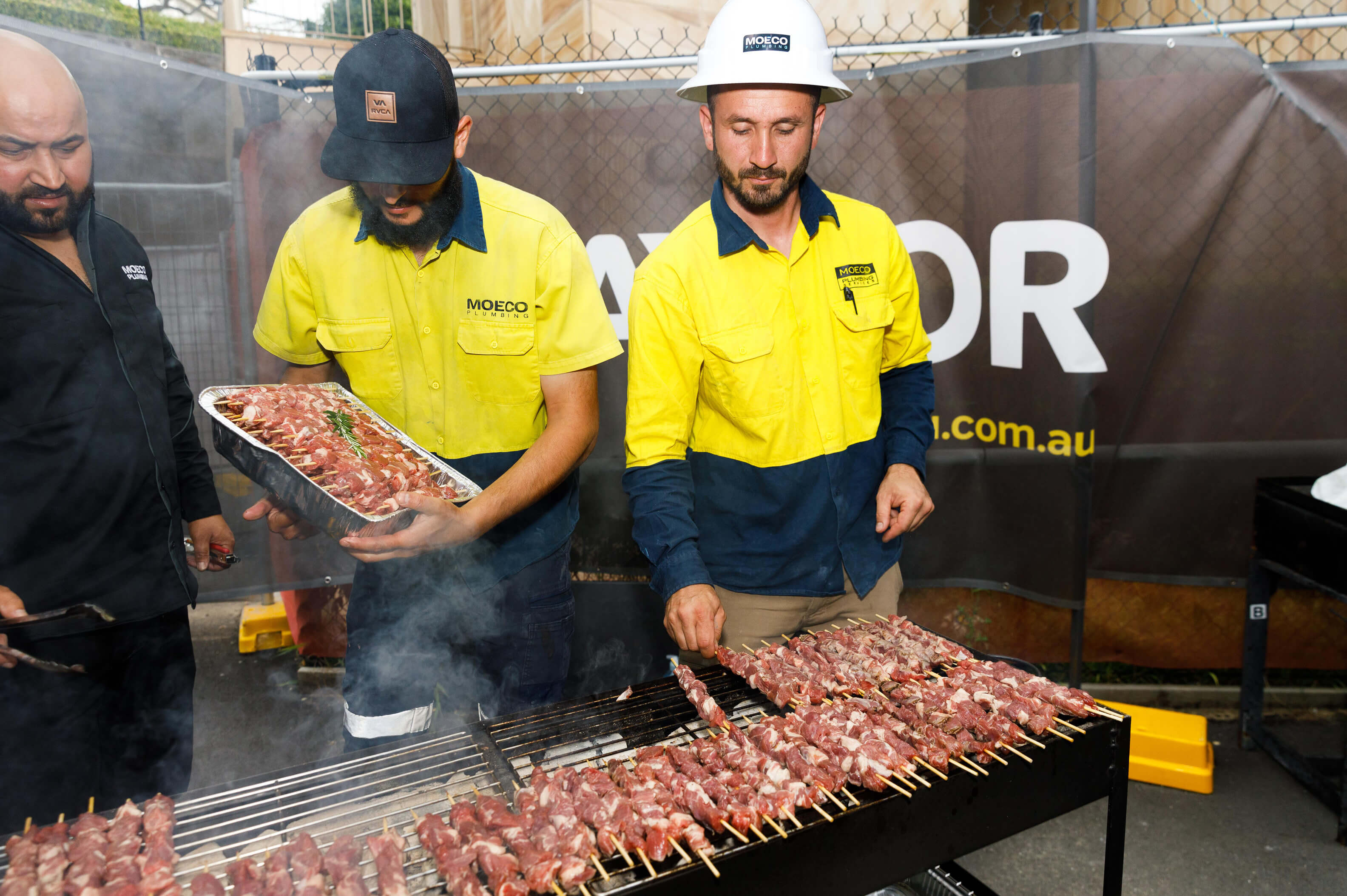 04 subcontractors at the bbq helm cooking the goods taylor news article property industry foundation hard hat day