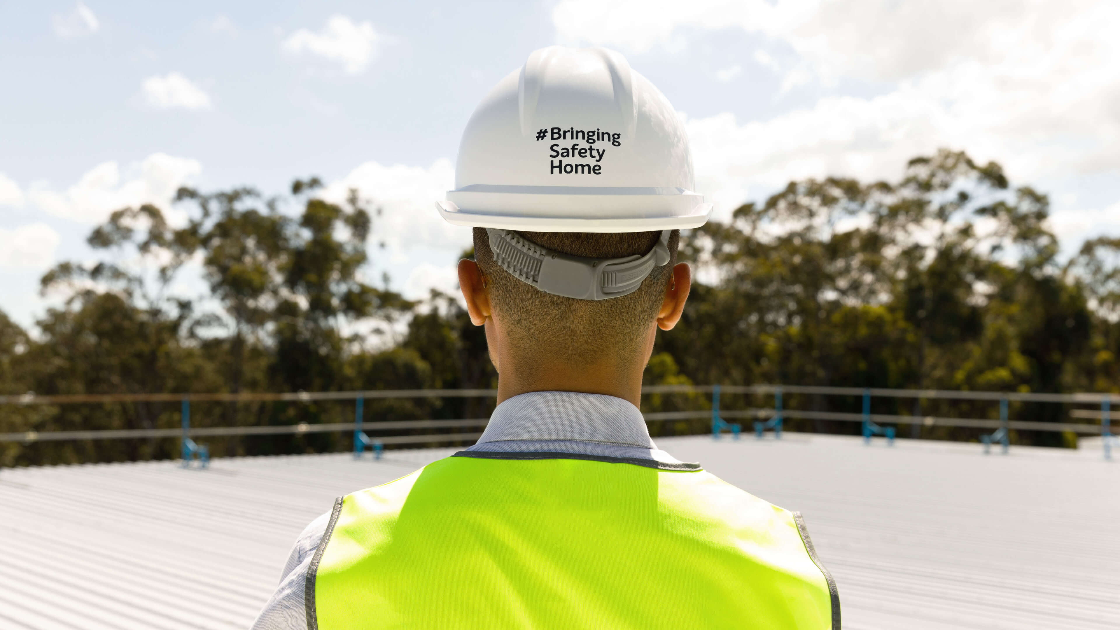 1 bringing safety home hero image with hashtag on the back of hardhat taylor construction photography 2