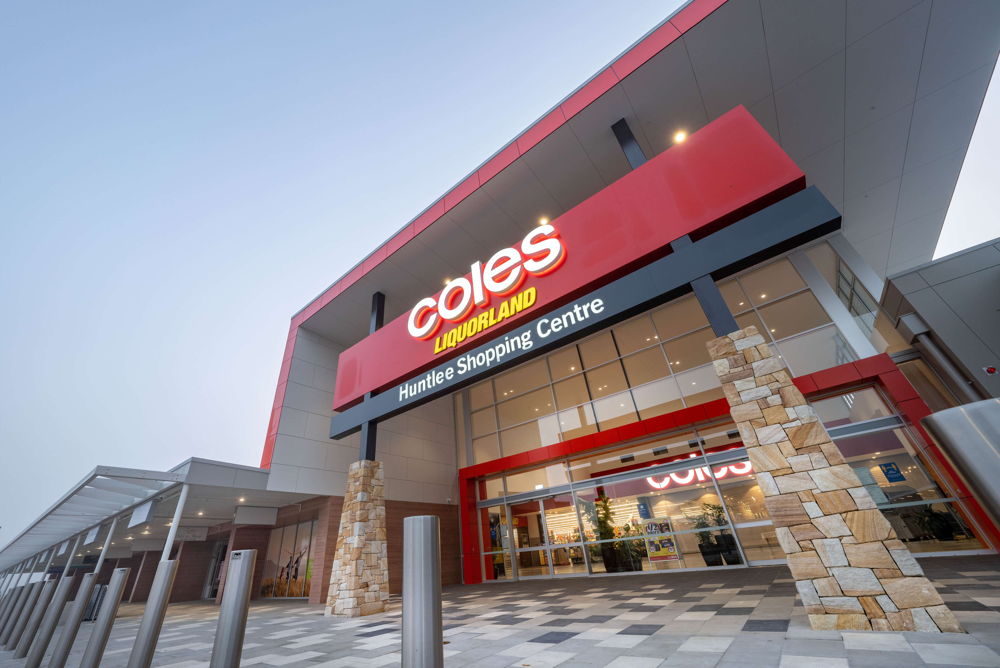 1 dusk facade at coles huntlee taylor construction retail