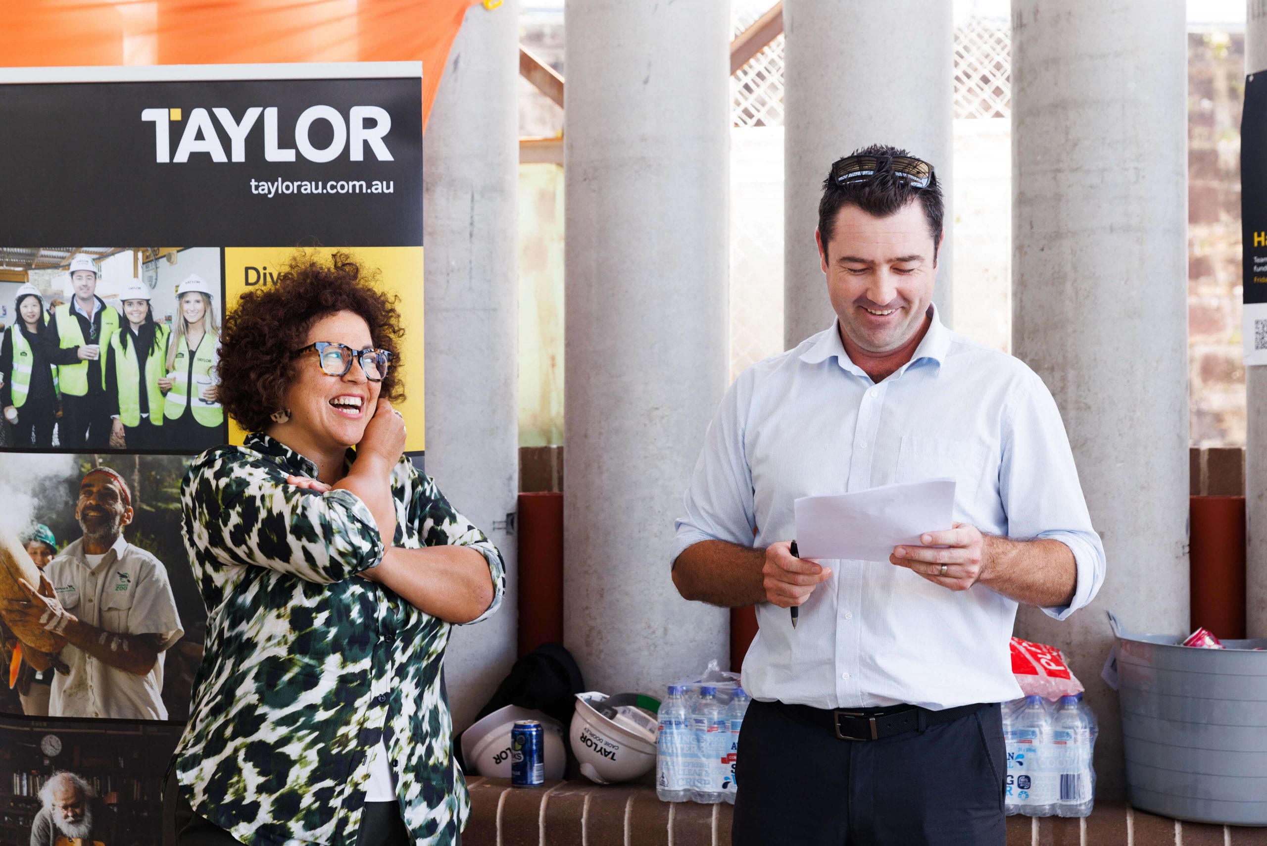 010 kate mills pif ceo and ben folkard laugh during audience address at taylor hard hat day 2022