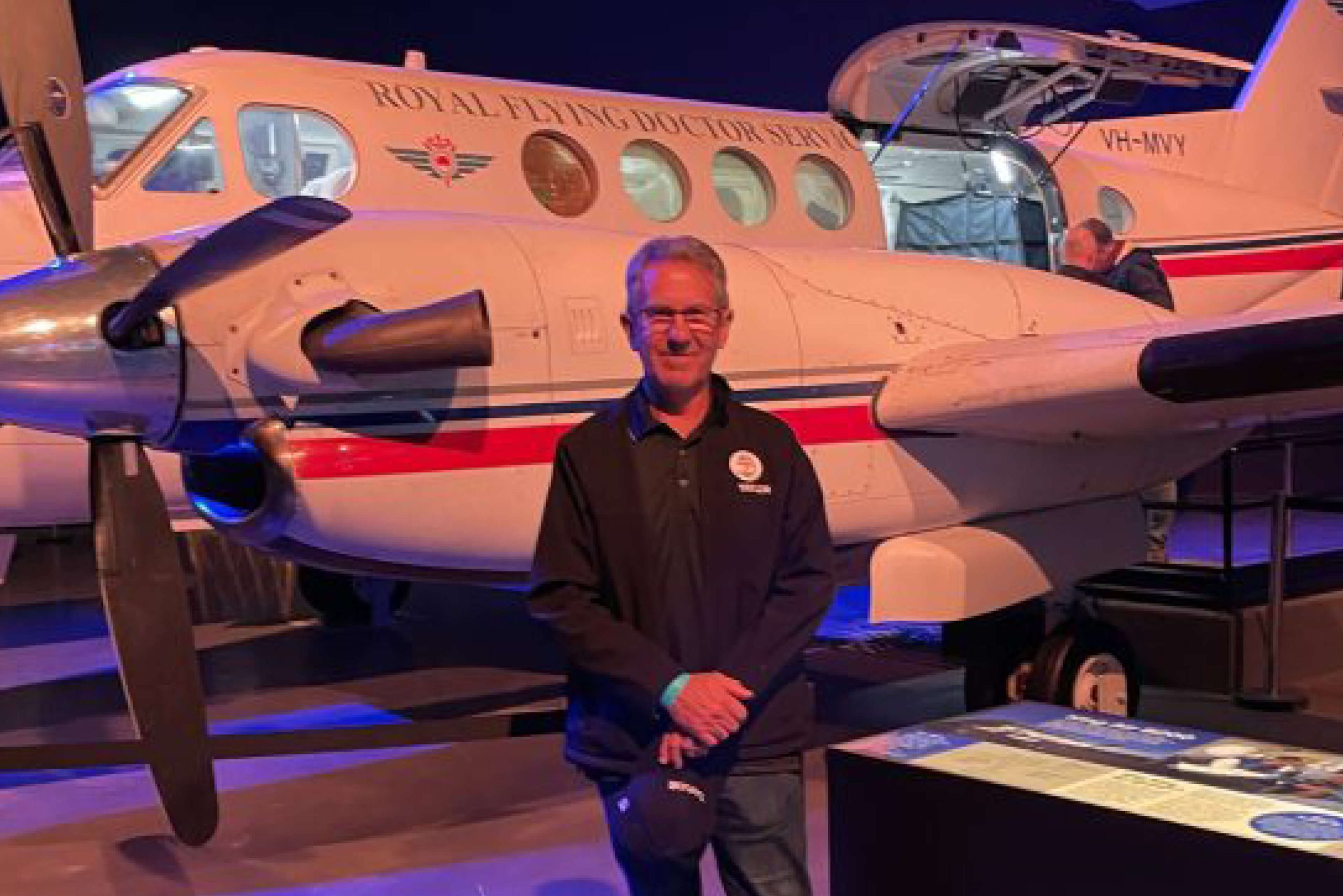 007 clive wickham royal flying doctors outback trek in front of plane taylor
