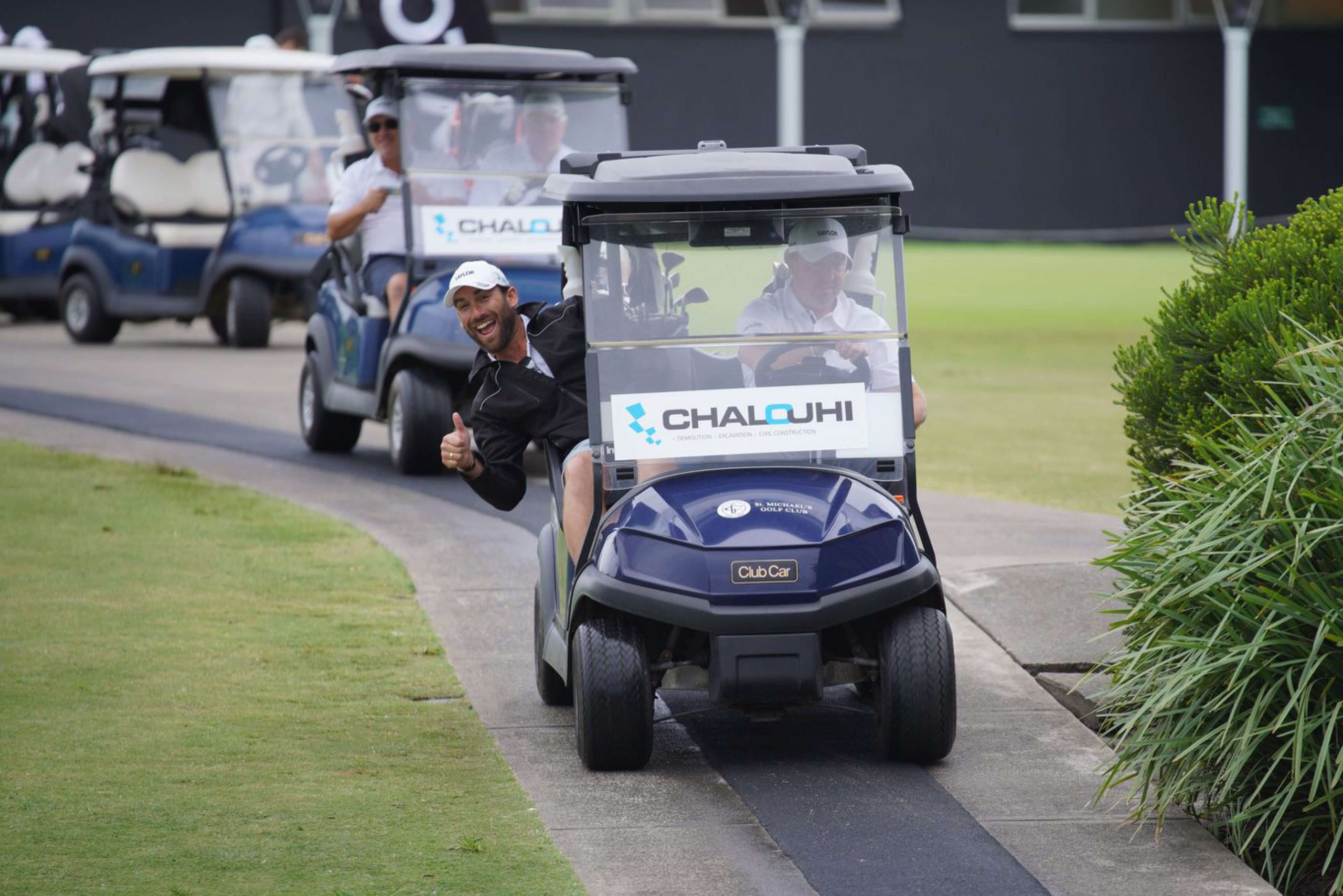 005 players leaving in caddy smiling thumbs up chalouhi taylor charity golf day 2023