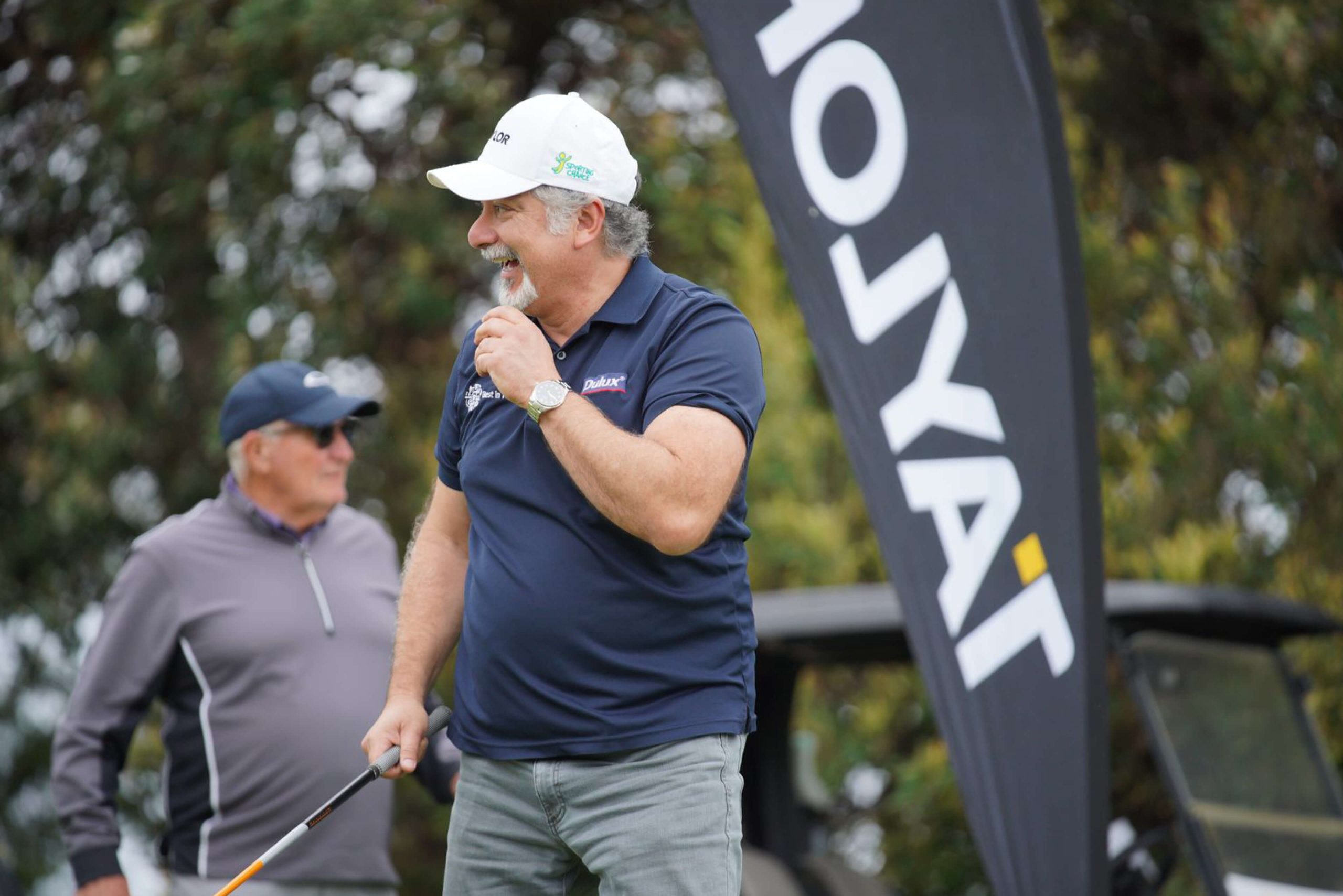 013 dulux group player laughs at team between shots at taylor charity golf day 2023