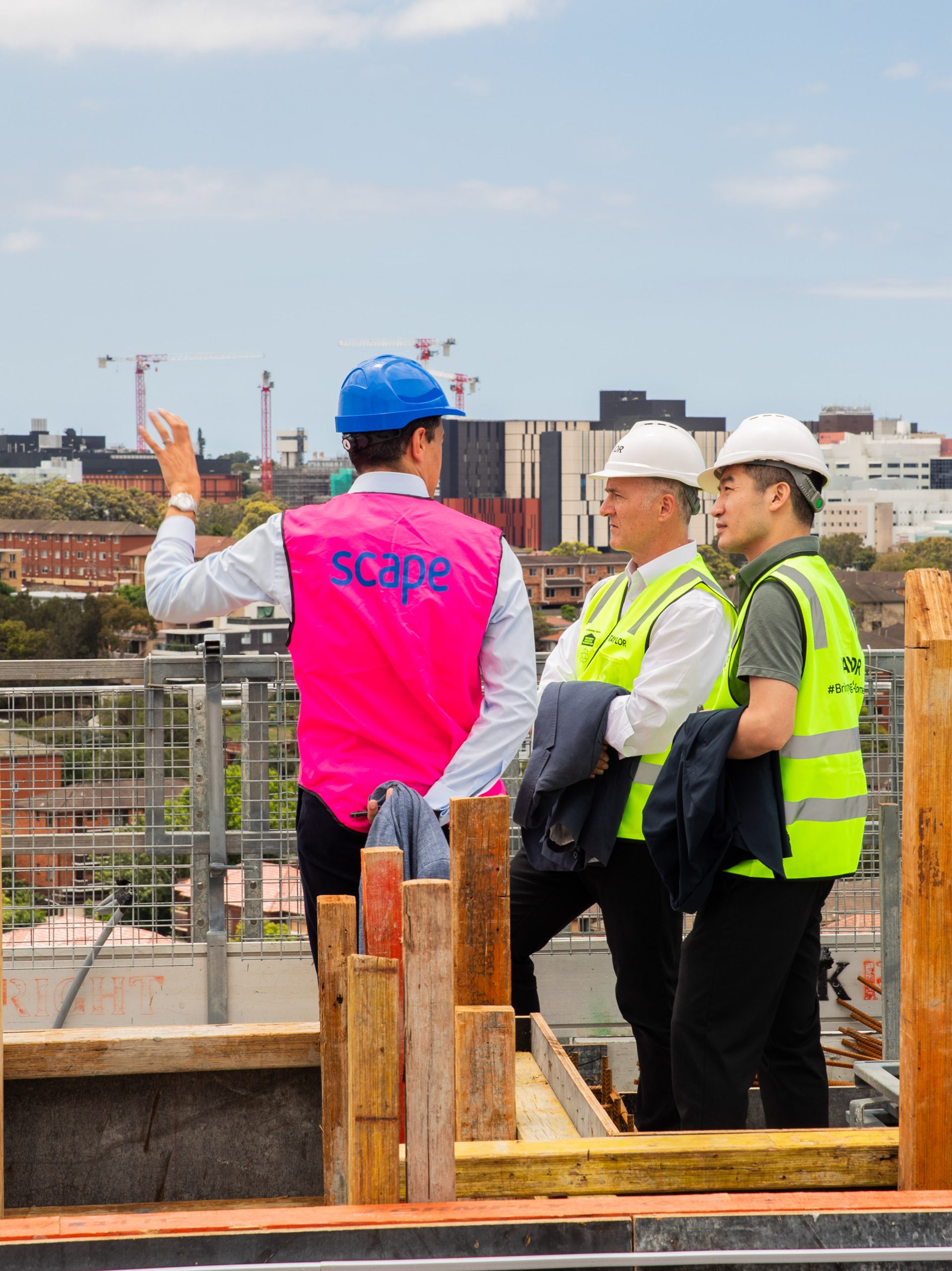 3 client pointing scape kingsford topping out ceremony taylor construction student accommodation