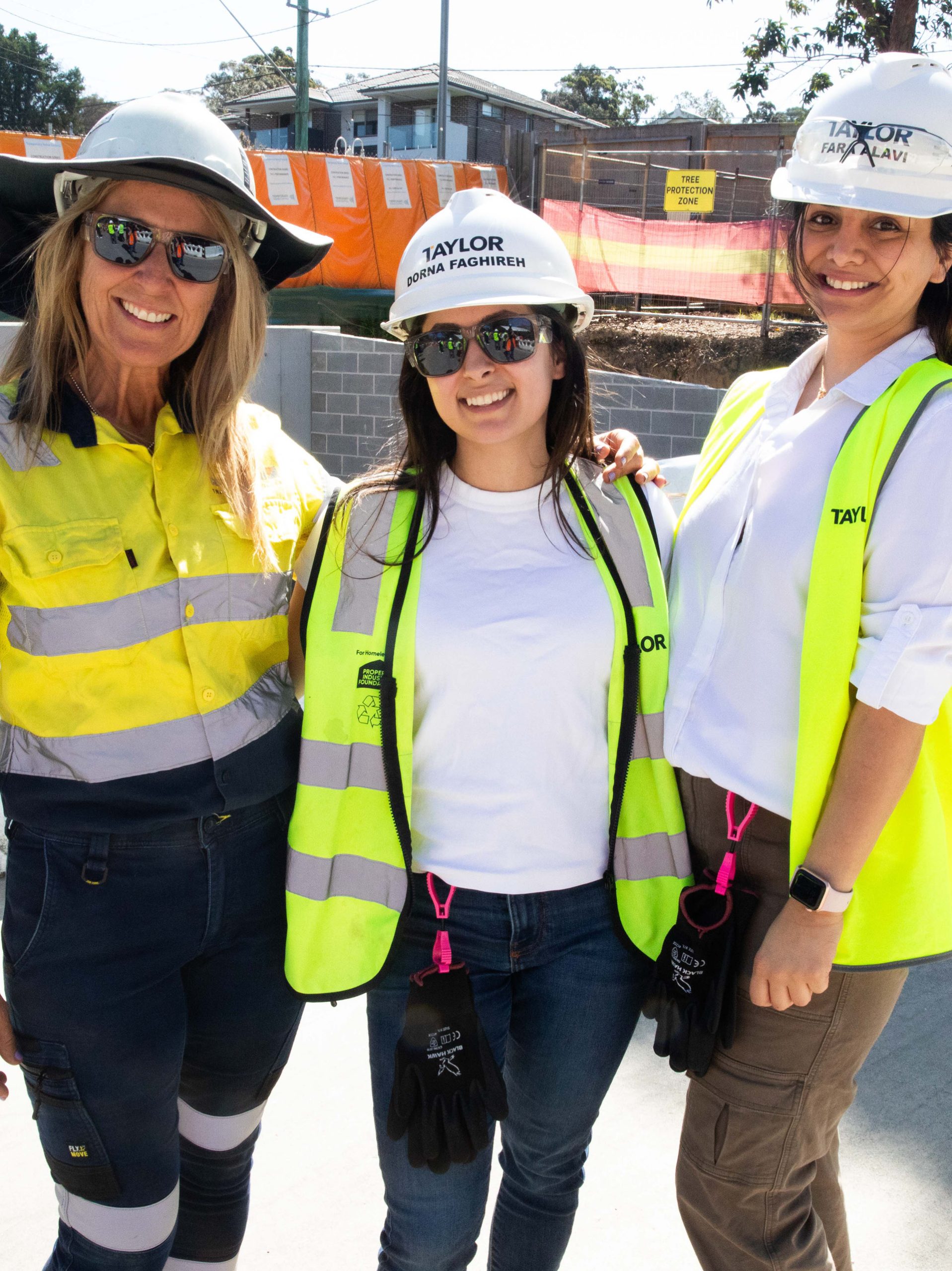 2 females pif hard hat day 2024 taylor construction fundraising community